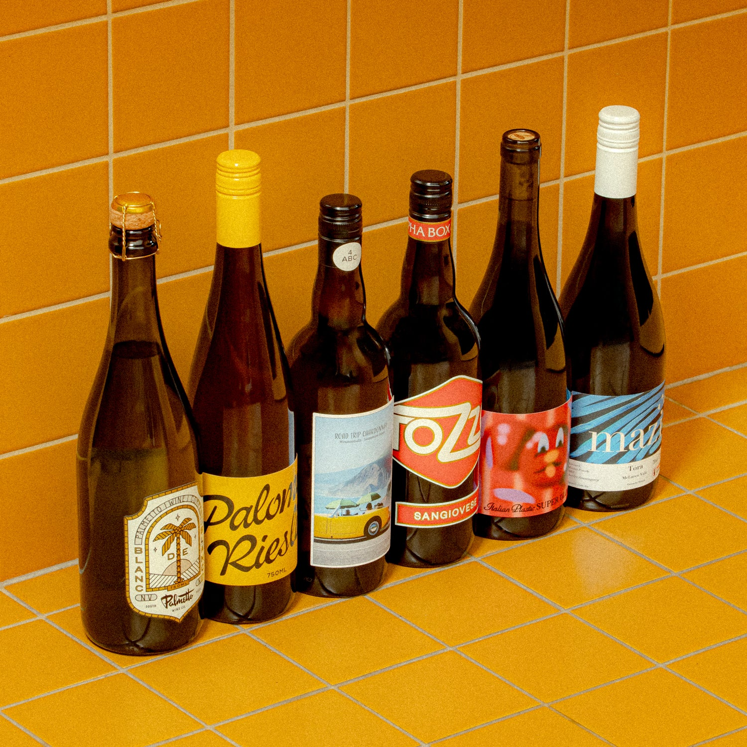 We've reached far and wide to find six wines for under a hundred dollars that'll make your taste buds stand to attention.