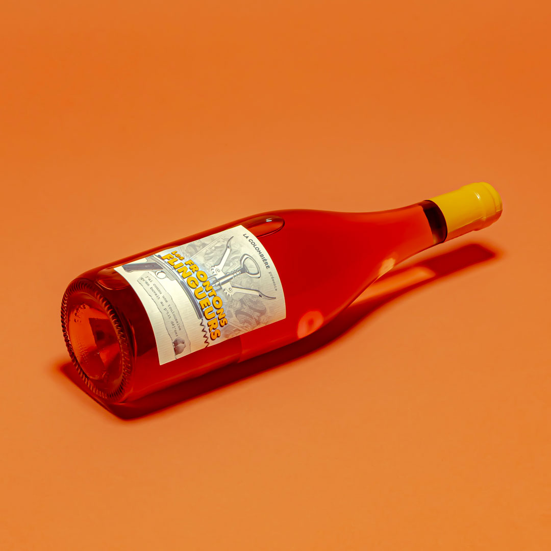 La Colombiere Negrette rosé wine bottle from Fronton France on orange background
